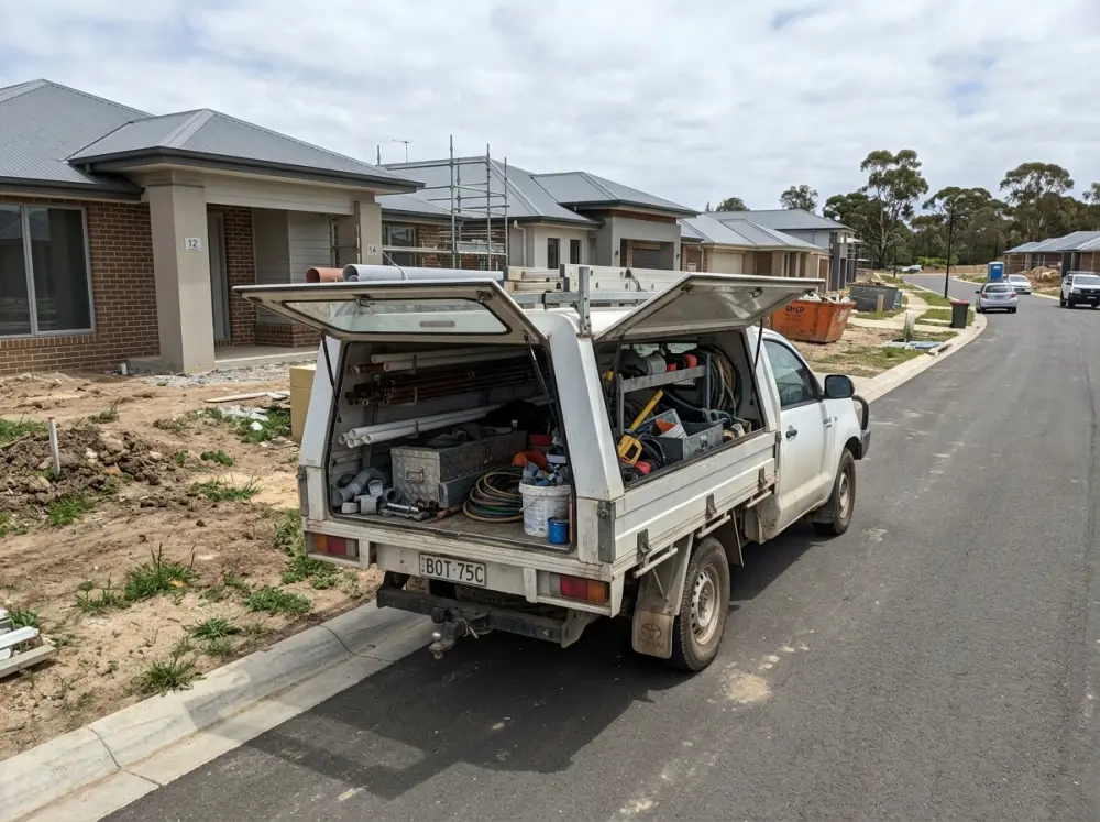 Gledswood Hills Plumber service van parked in a new estate street